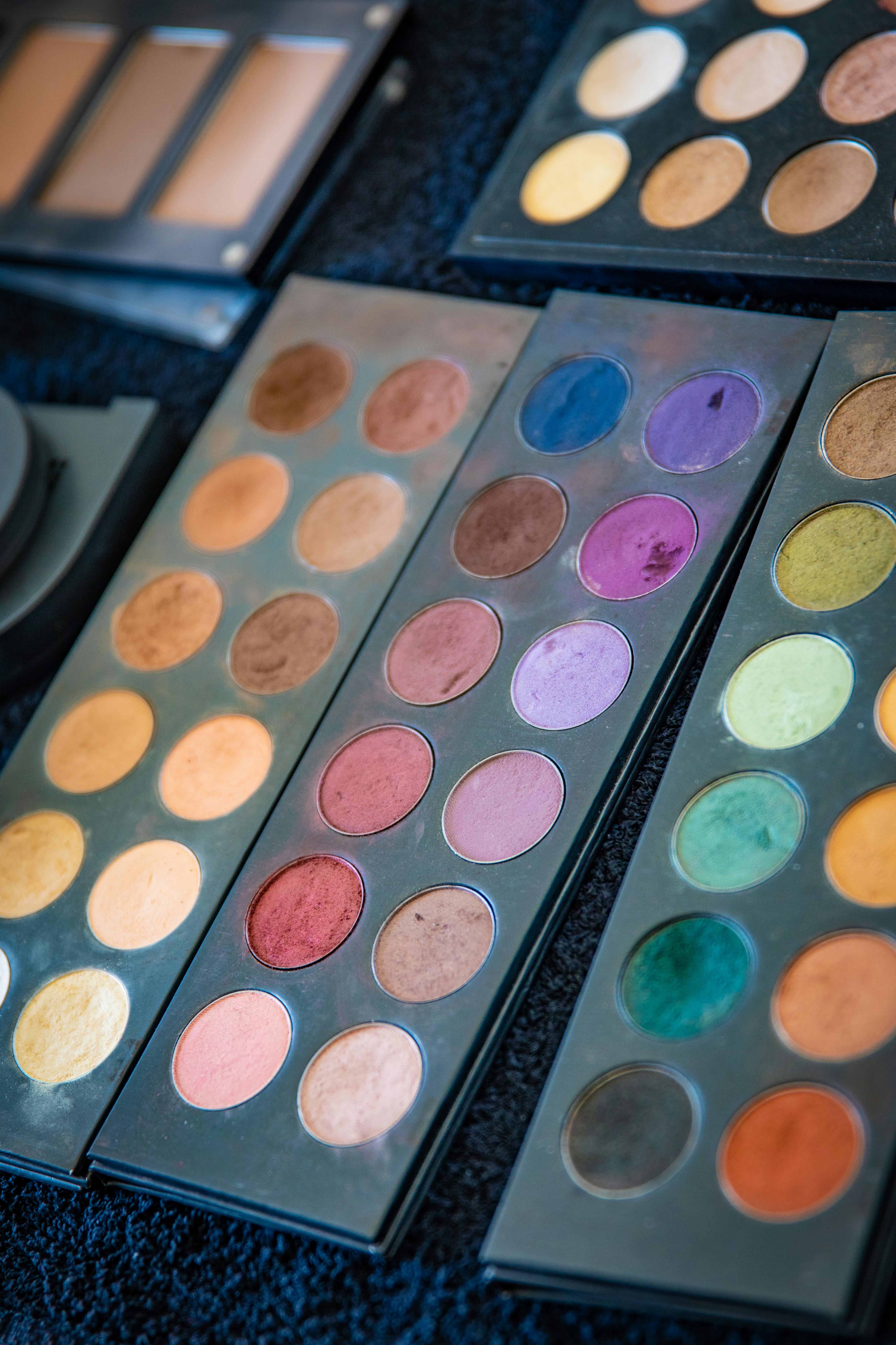 A designer looking at a screen with various vibrant color palettes for a new marketing project.