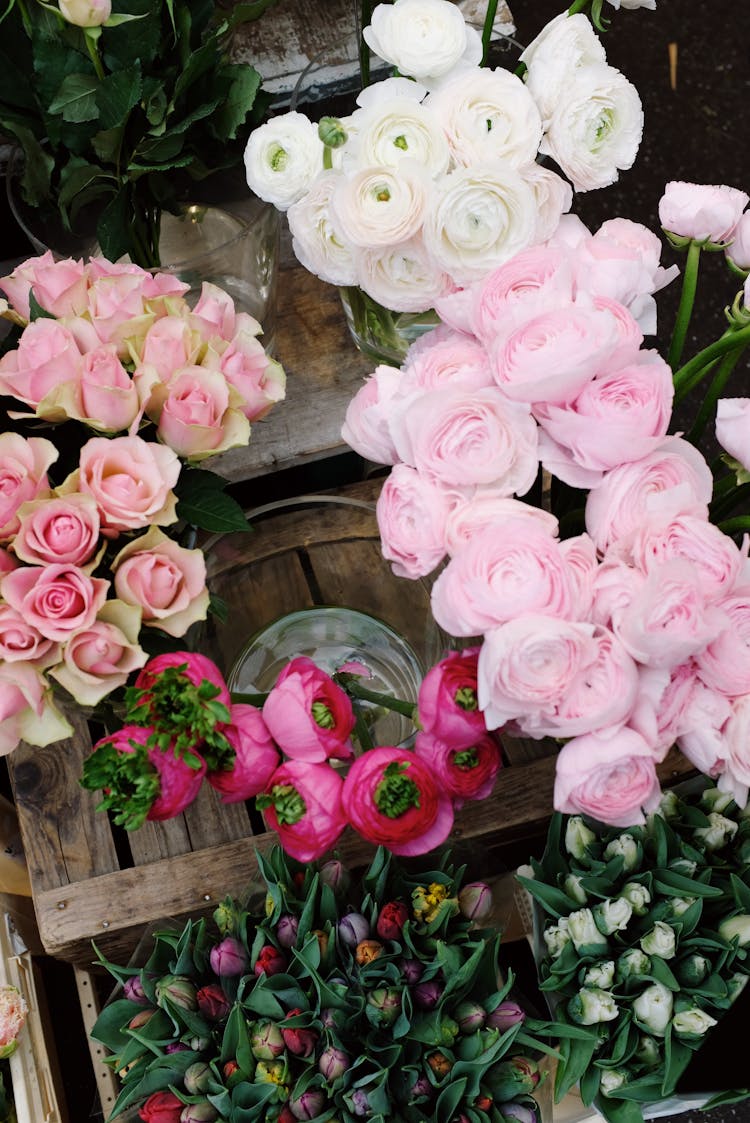 Assorted Fresh Flowers In Wooden Box On Stall On Market