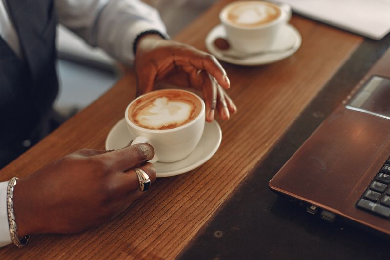 Solo entrepreneur working on a laptop, planning daily social media posts