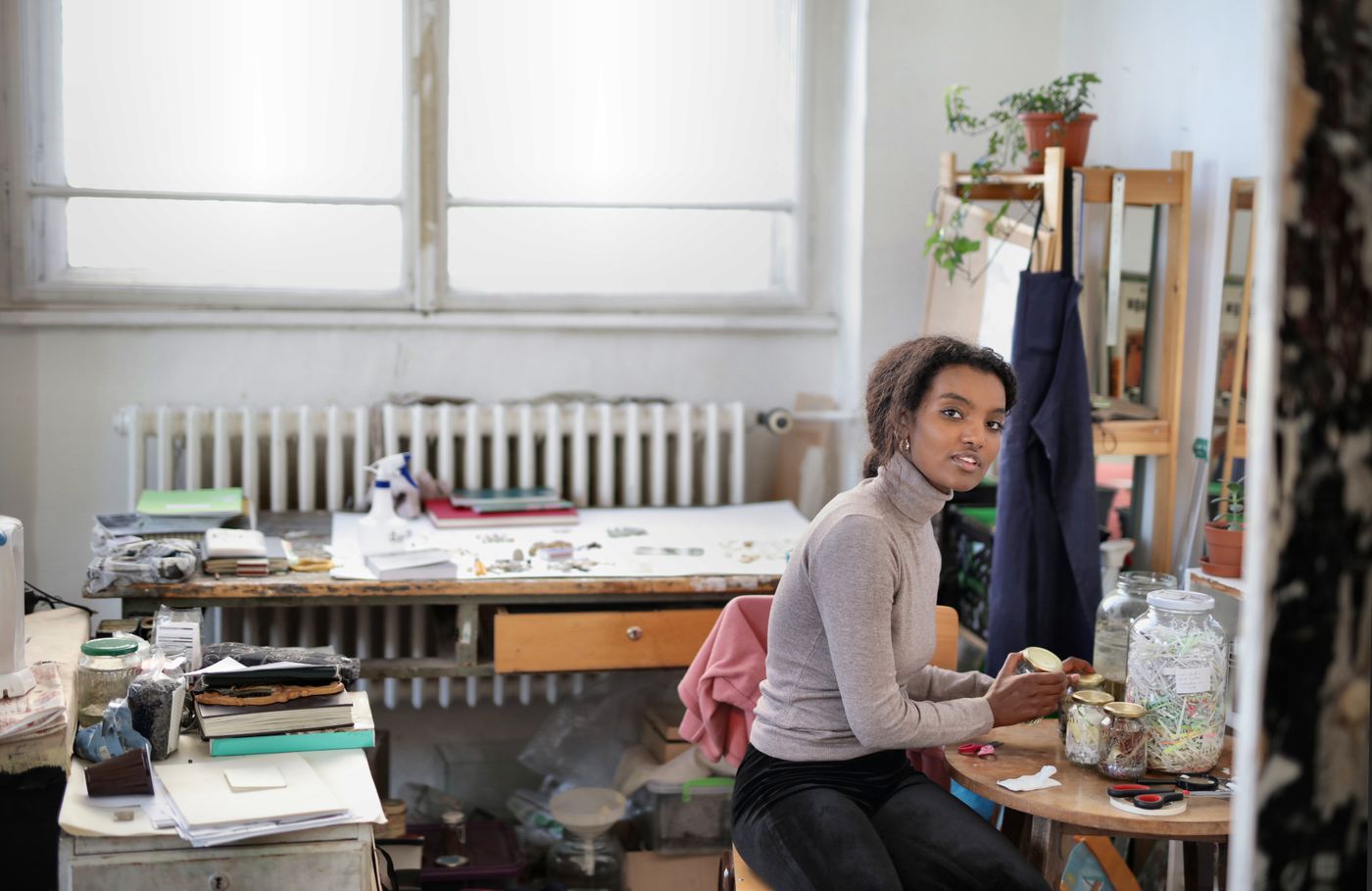 Marguerite Oyelaran at her lettering desk — photo by Andrea Piacquadio on Pexels