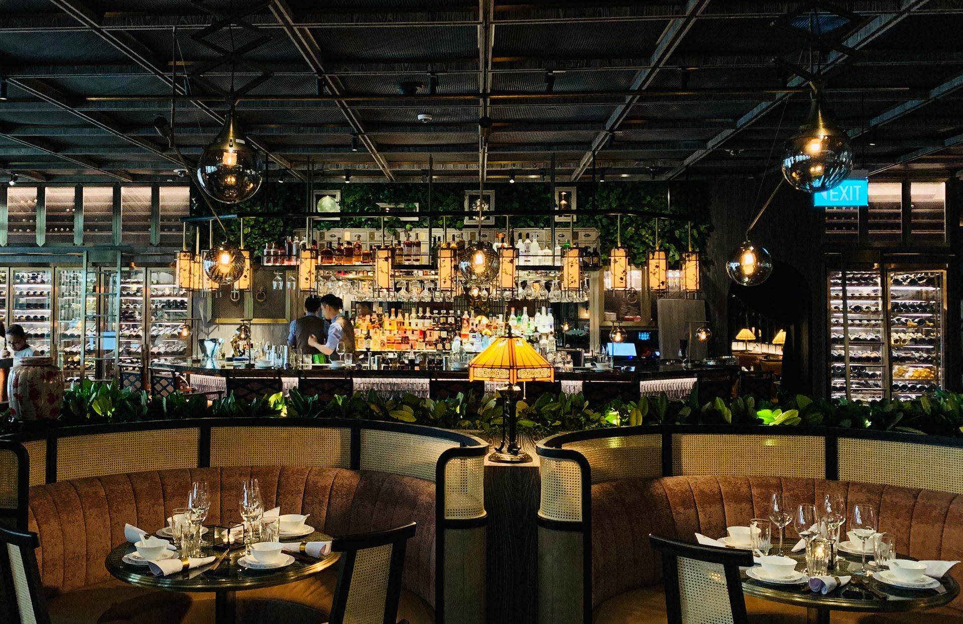 Cozy and elegant restaurant scene with stylish bar and seating area, perfect for dining out.