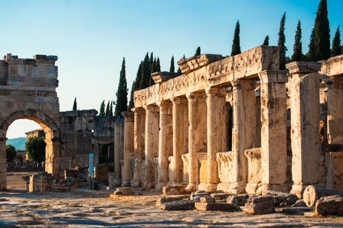 Free Stunning view of Hierapolis ruins at sunset, featuring ancient columns and arches. Stock Photo