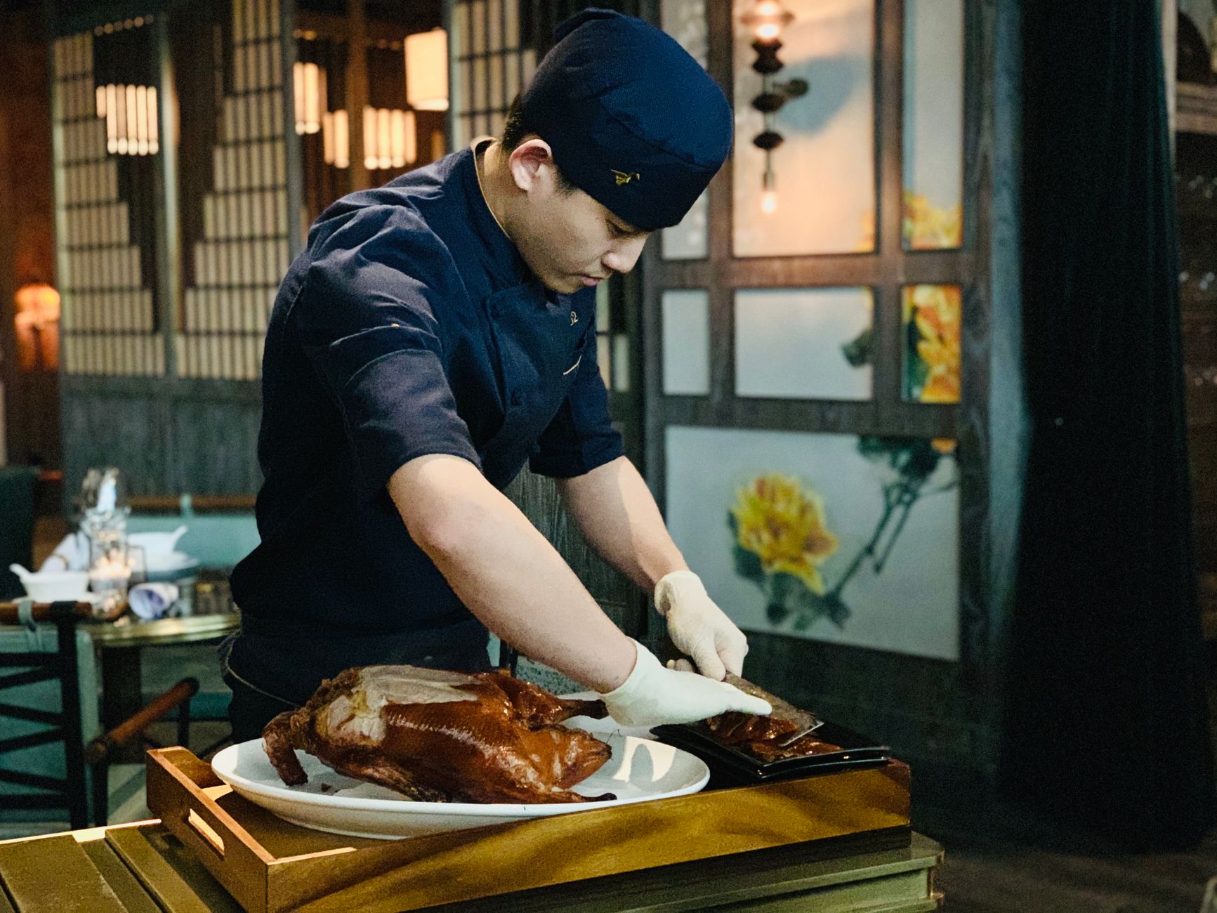 Chef carving roast at an event station