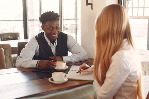 Free Two People Having Coffee While Talking Stock Photo