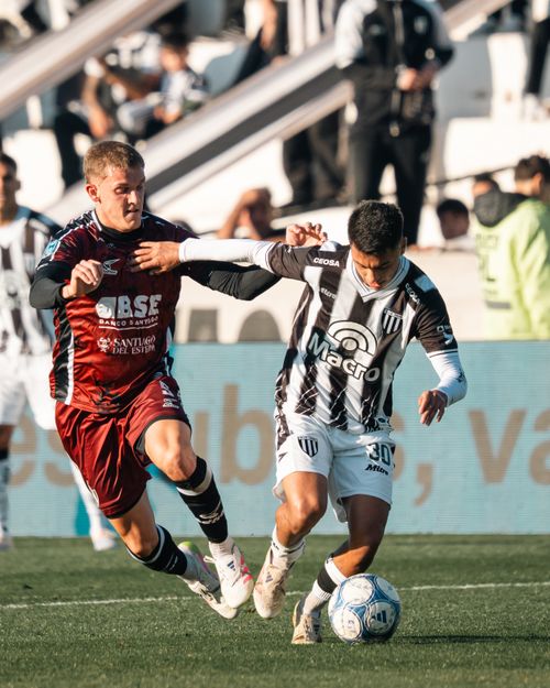 Free Two soccer players competing fiercely during a match. Stock Photo