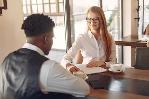 Free Man Being Interviewed By A Woman  Stock Photo