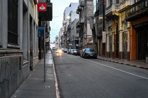 Free Empty street in Montevideo, Uruguay at dusk, showcasing historic architecture and urban scenery. Stock Photo