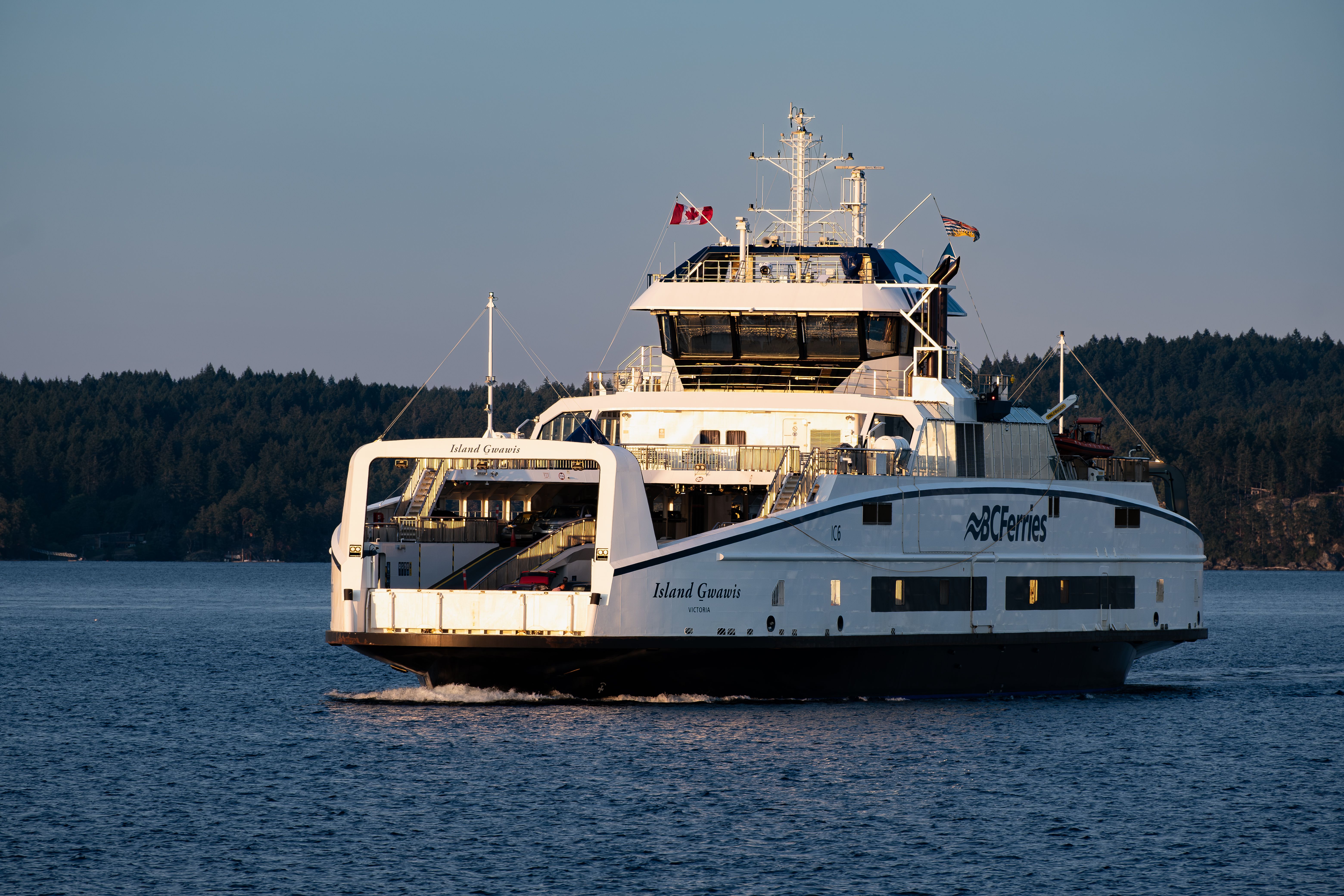 BC Ferries vessel Island Gwawis at sea during sunset in British Columbia, Canada.