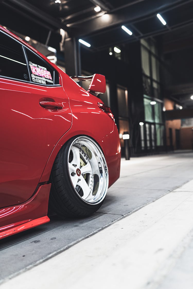 Modern Automobile Of Red Color In Showroom