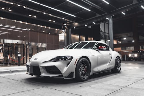 Photo Of Supra Parked In Front Of Building