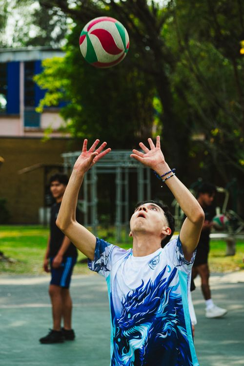 Free Dynamic outdoor volleyball scene capturing youthful energy and athleticism. Stock Photo