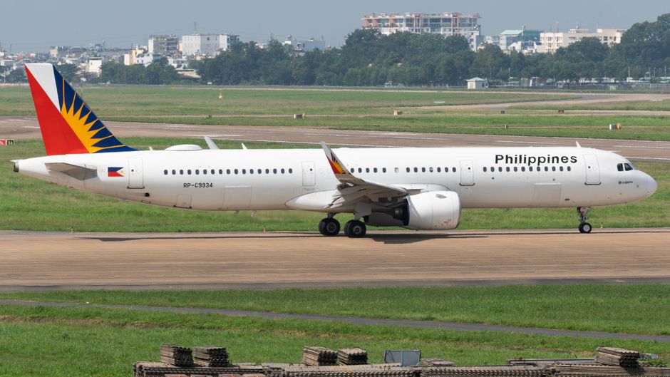 Cebu Pacific airplane at a Philippine airport, ready for domestic travel between regions