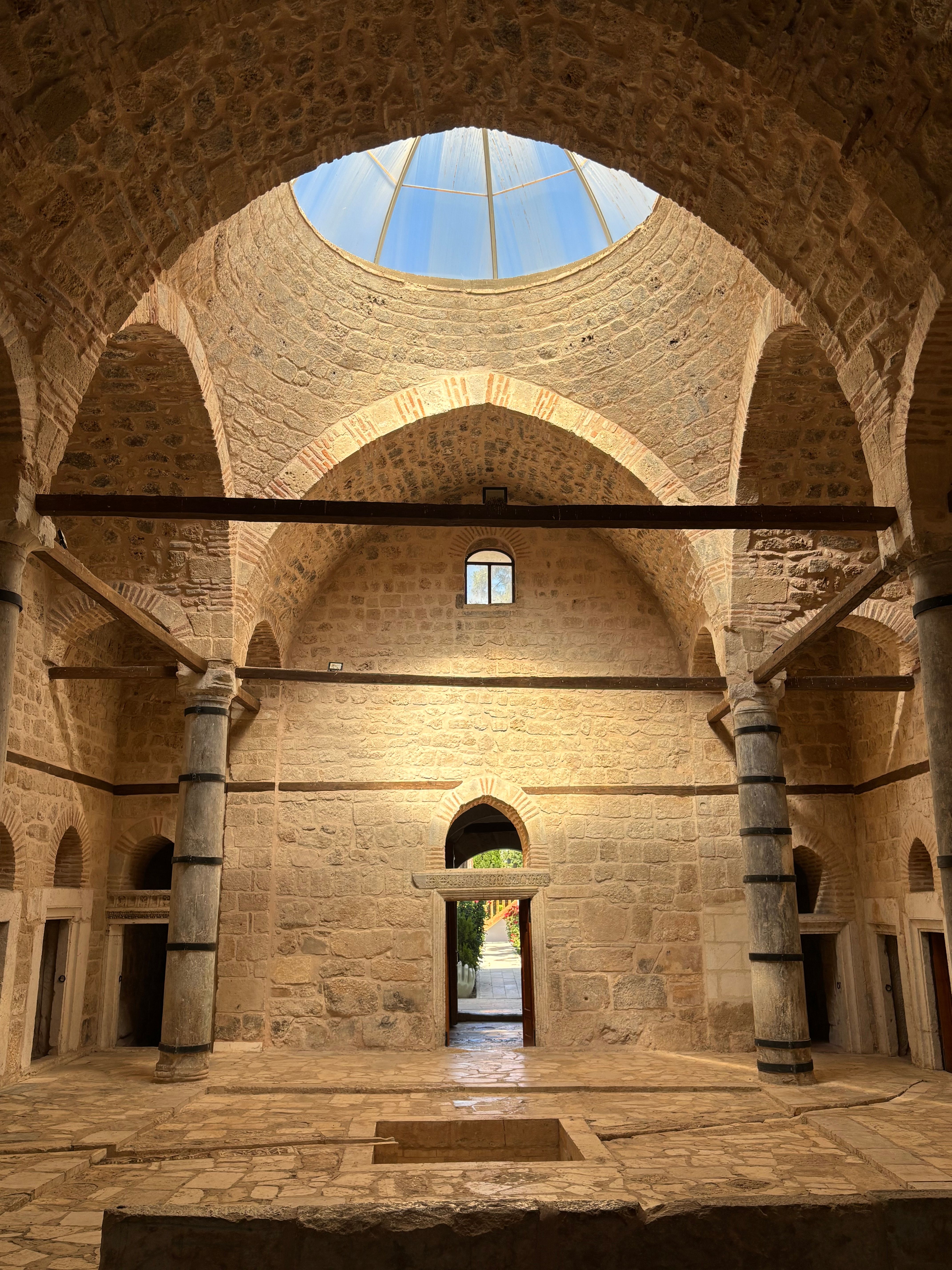 Explore the stunning interior of a historic Ottoman bath in Atabey, Isparta, Türkiye with skylight views.