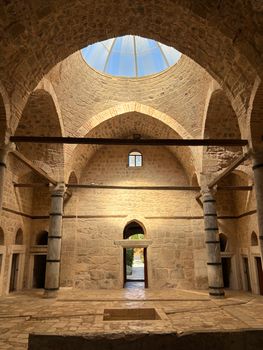 Explore the stunning interior of a historic Ottoman bath in Atabey, Isparta, Türkiye with skylight views.