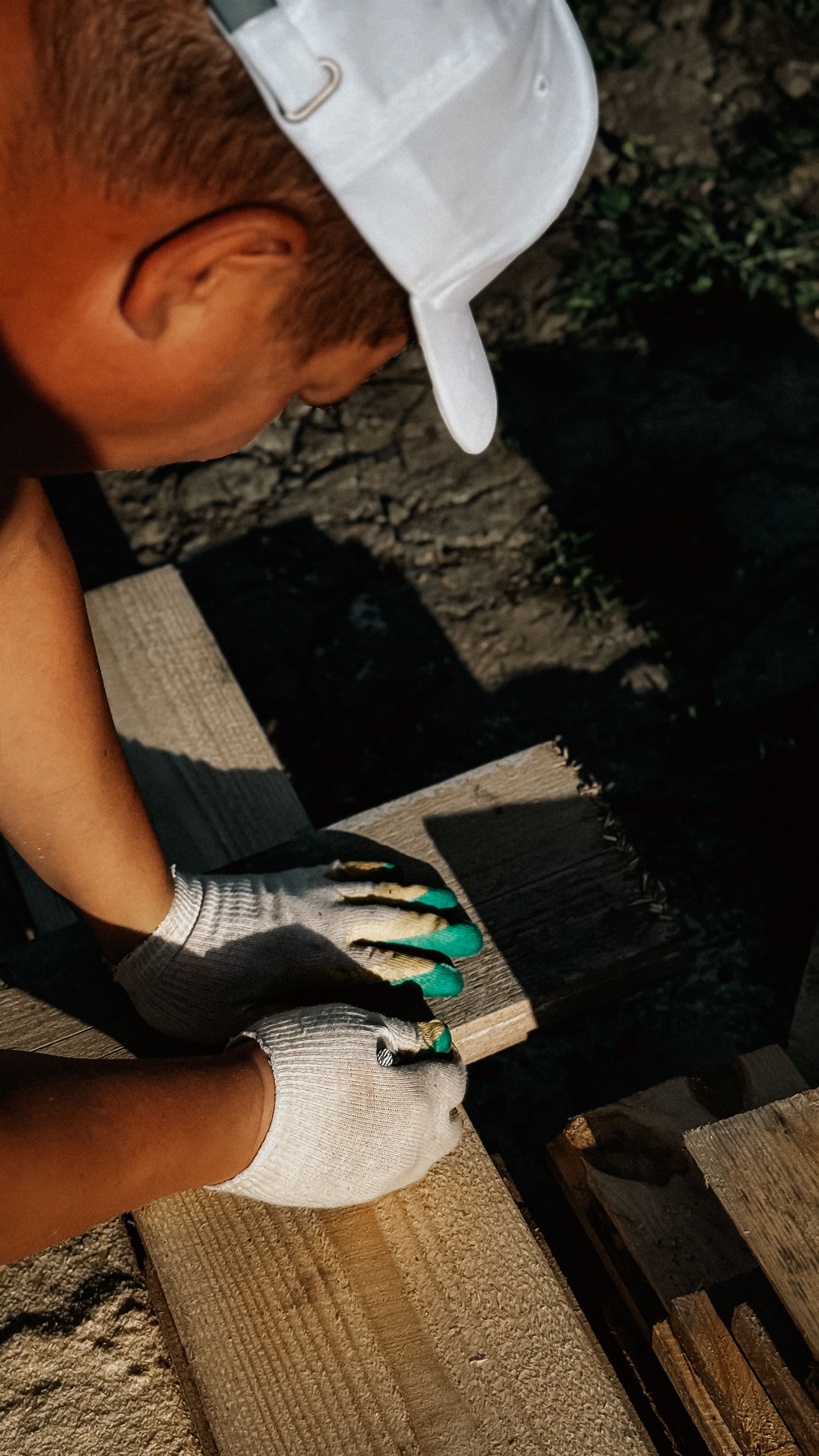 Trade Contractor Licence: What It Is, When You Need It & How to Apply Smarter 7 Carpenter measuring a wooden plank outdoors
