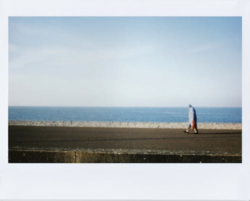 A Person Walking on the Road