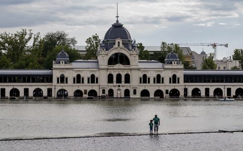 Free Scenic shot of Vajdahunyad Castle partially submerged, capturing a moment of flooding in Budapest. Stock Photo
