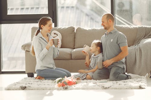 Happy family having fun in living room at home