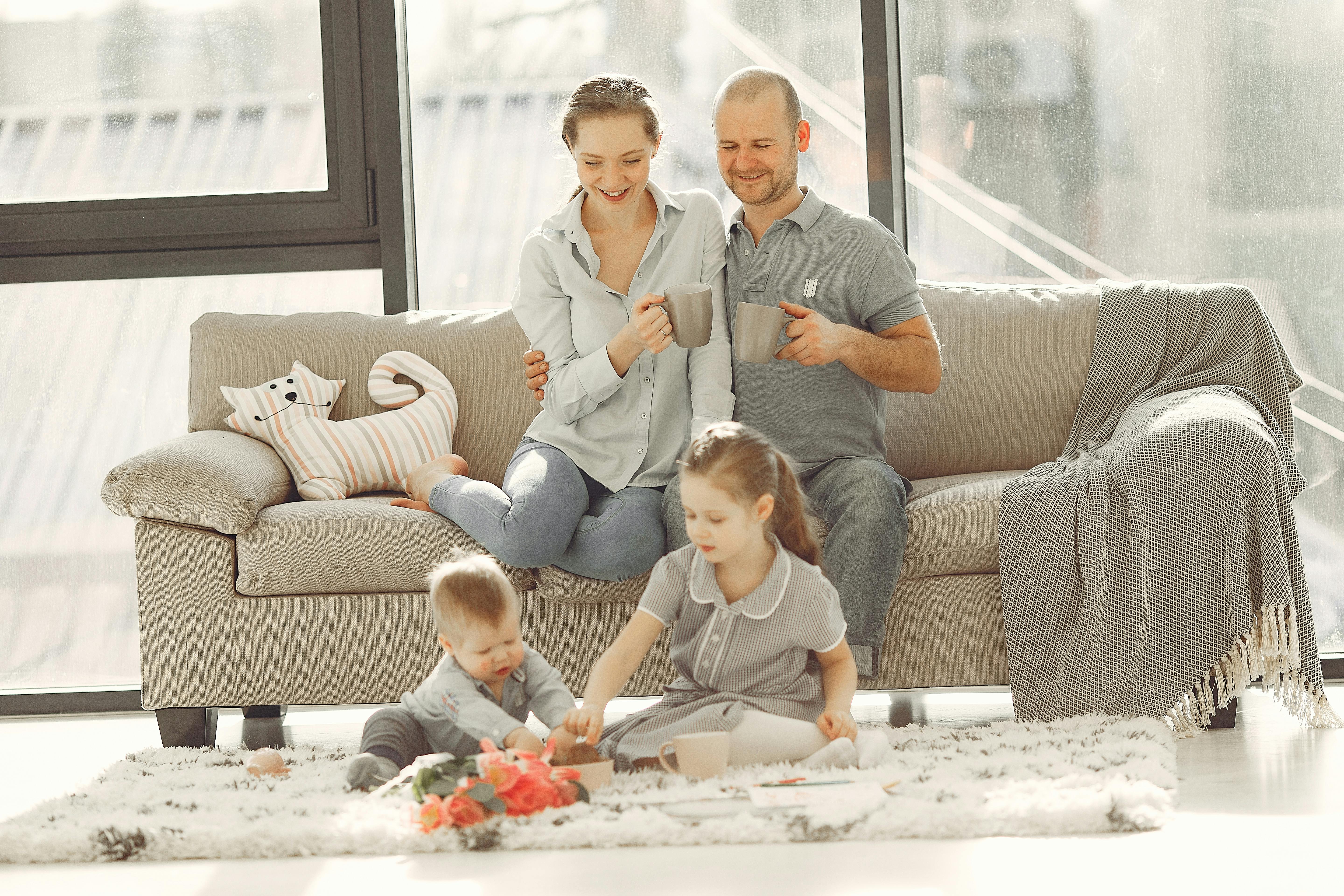 Happy family having fun in living room at home · Free ...