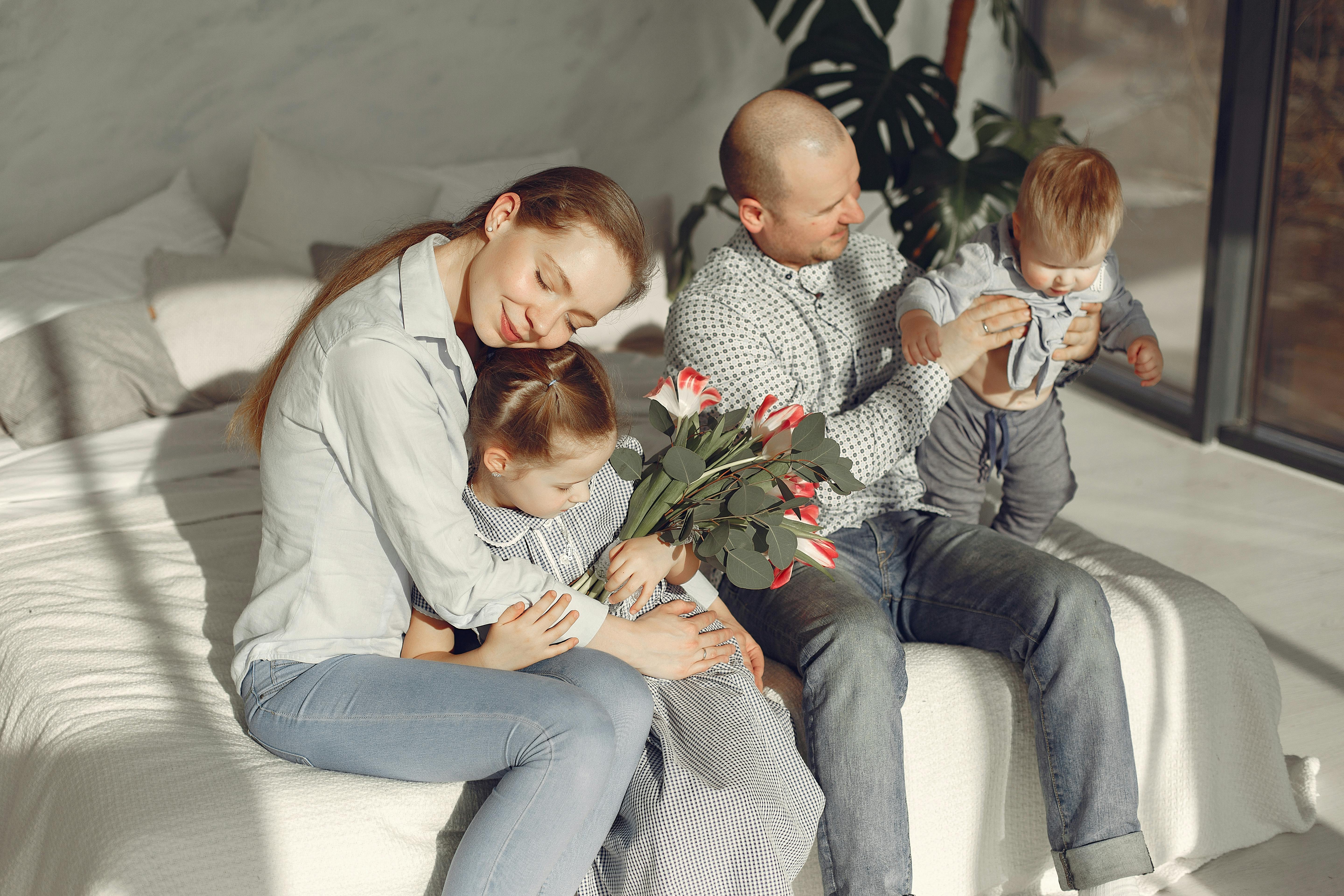 happy family resting on bed during weekend