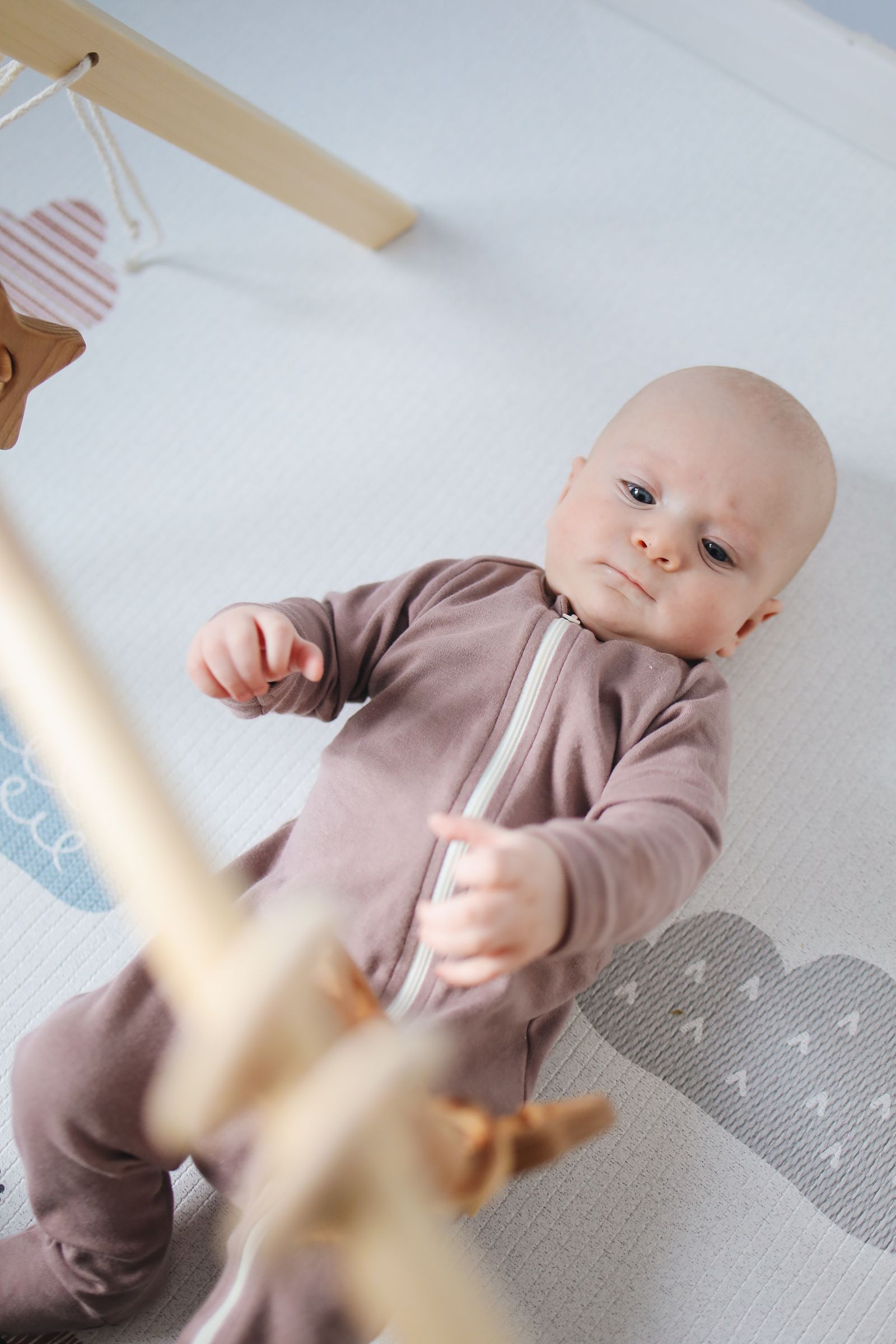 Baby resting beside a thoughtfully prepared changing space