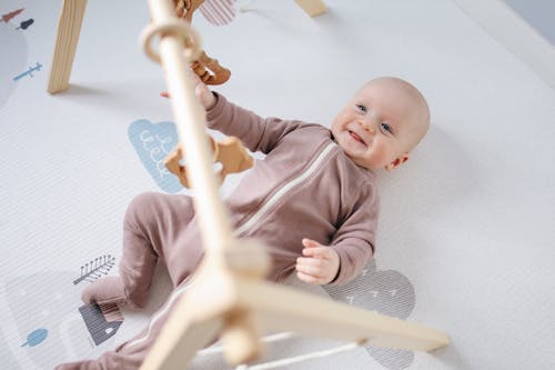 Free Photo Of Baby Laying On bed Stock Photo