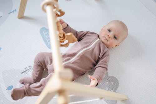 Photo of Baby Lying On Bed