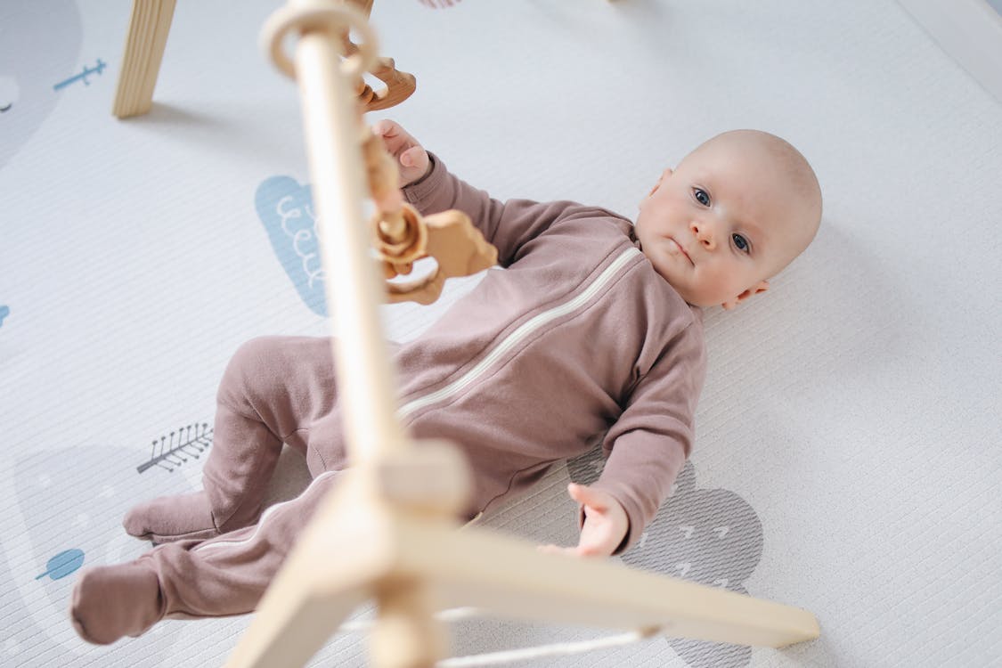 Free Photo of Baby Lying On Bed Stock Photo