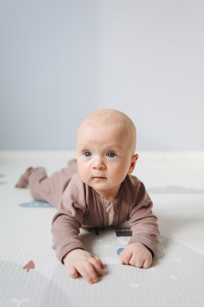 Photo of Baby Lying On bed · Free Stock Photo
