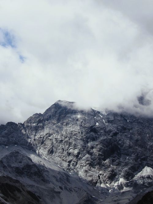 Free Captivating image of the majestic Ortler mountain peak enveloped in clouds. Stock Photo