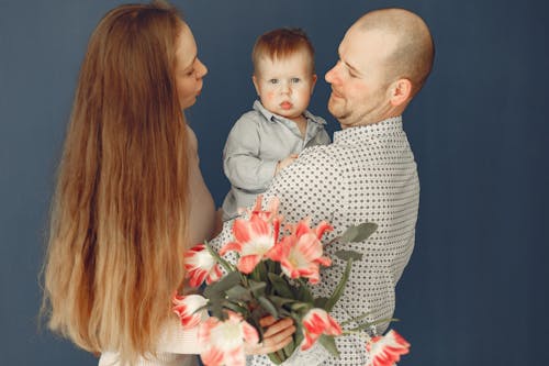 Happy family with bouquet of flowers