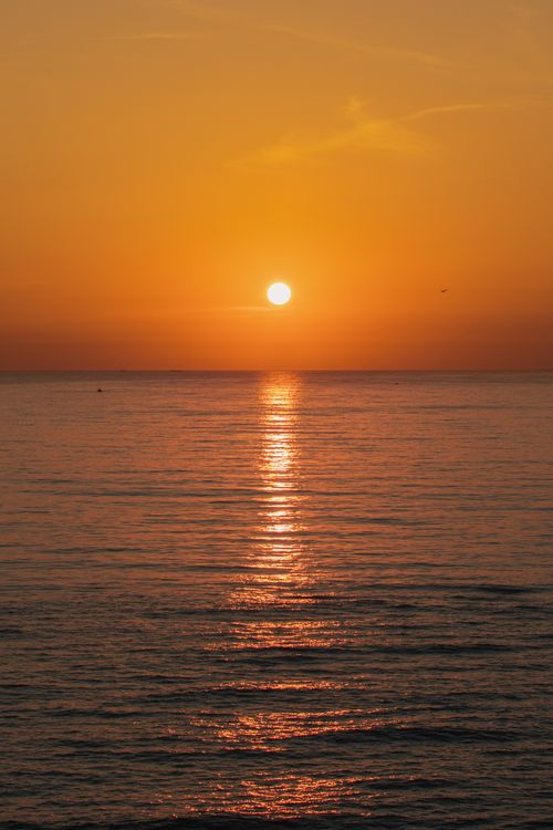 Free Serene sunset view over the ocean at Cua Tung in Quang Tri, Vietnam. Stock Photo