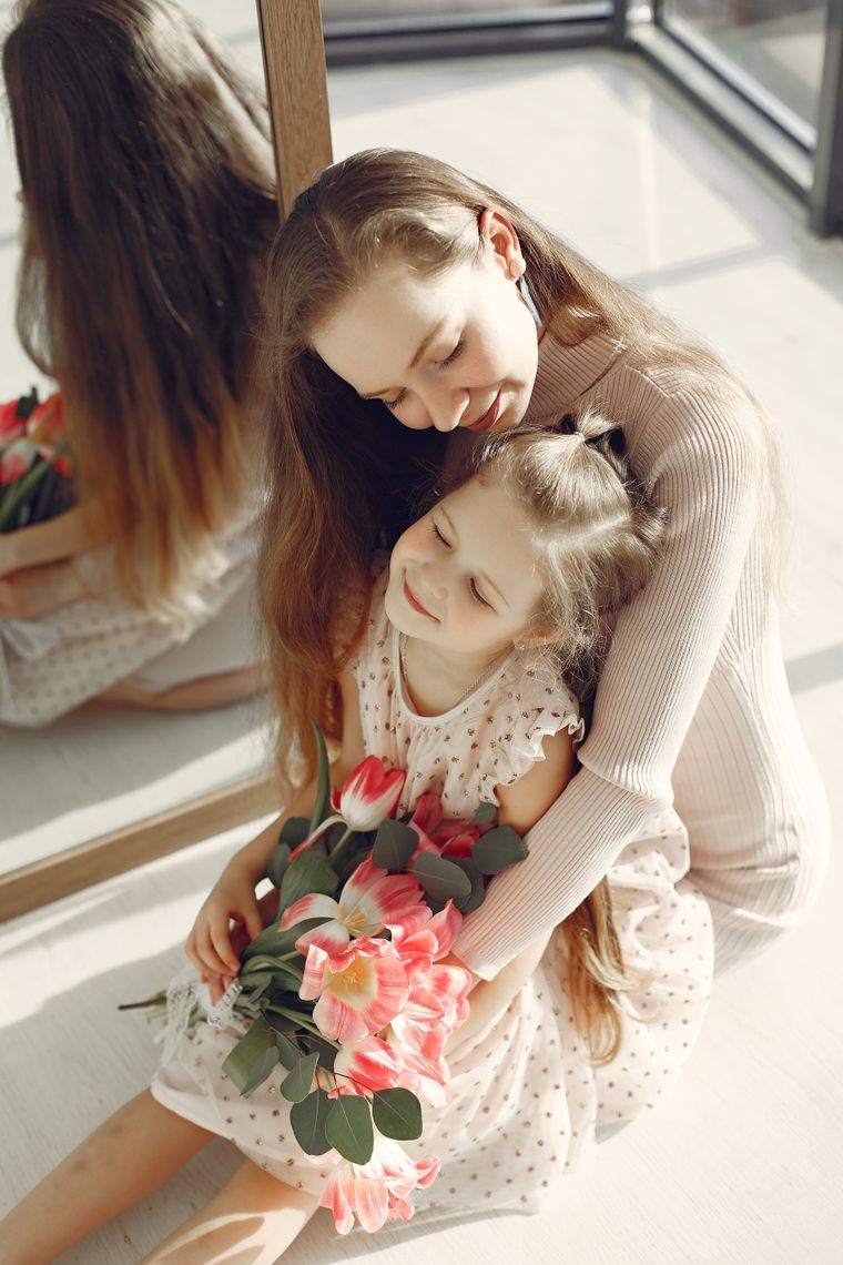 Mother and daughter with flowers