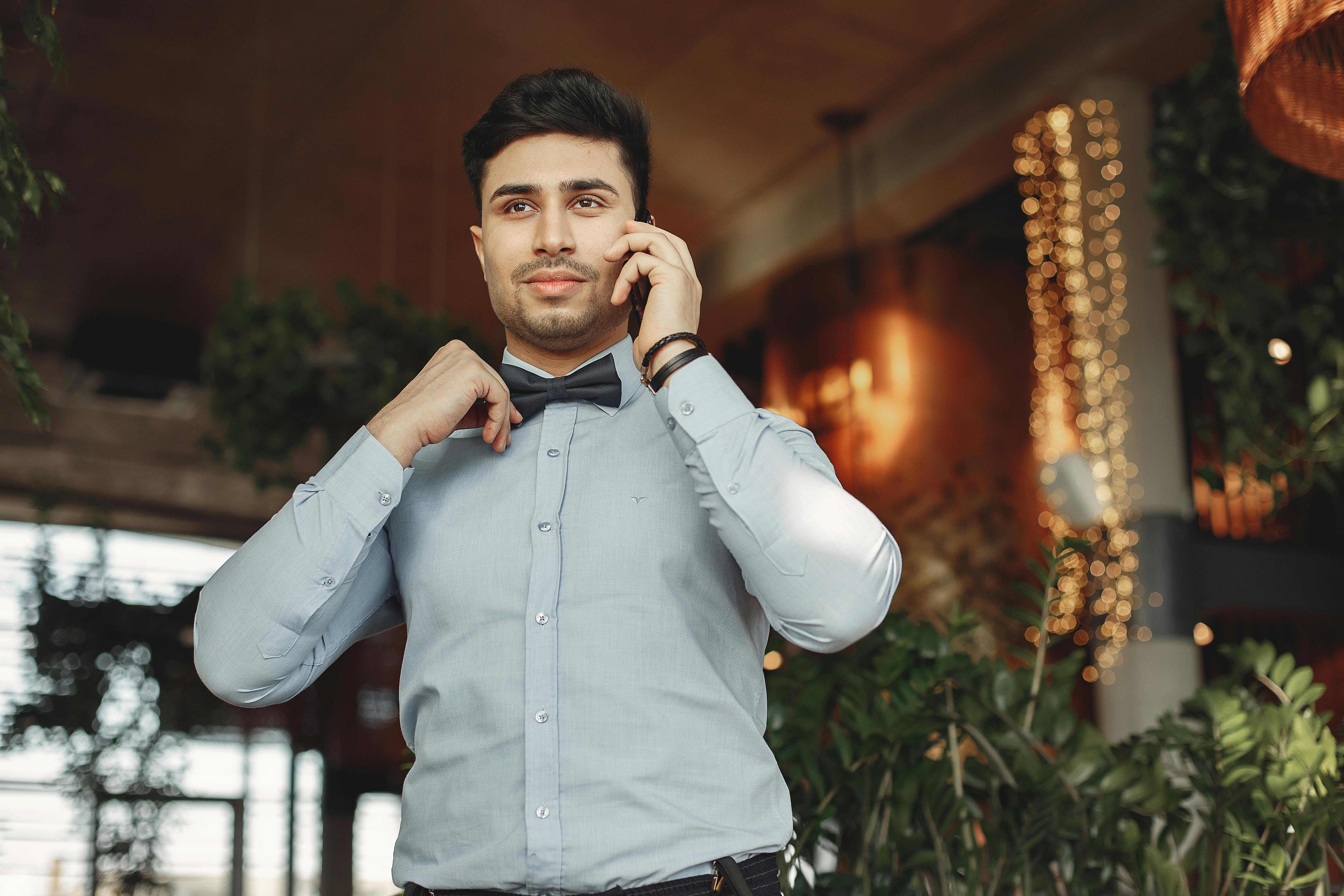 stylish man in suit talking on phone