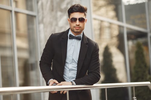 Man In Black Suit Jacket Wearing Sunglasses