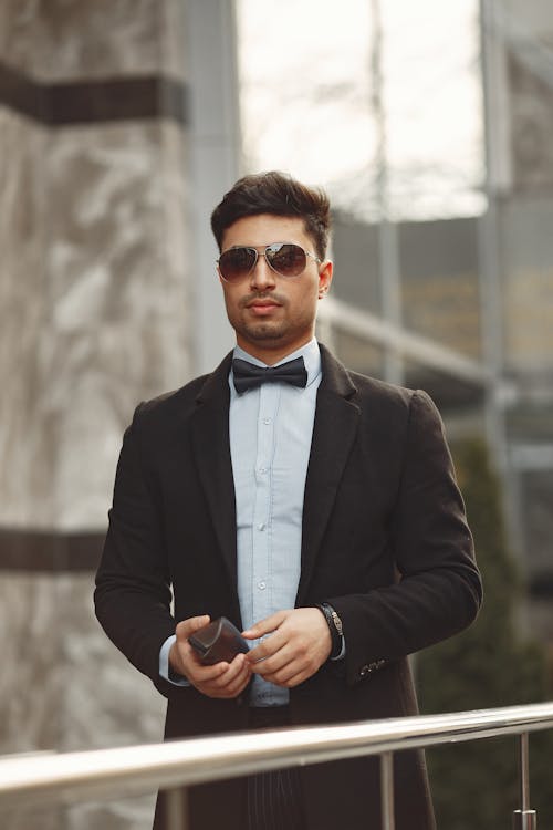 Man In Black Suit Jacket Wearing Sunglasses