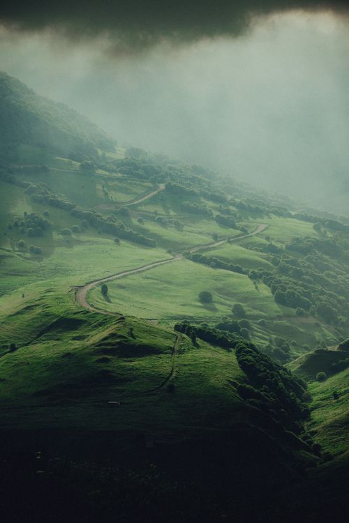 Free A breathtaking view of the misty green mountains and valleys in Chechnya, Russia. Stock Photo