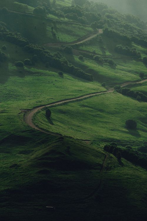 Free Explore the tranquil green hills and winding path in Russia's Chechen Republic. Stock Photo