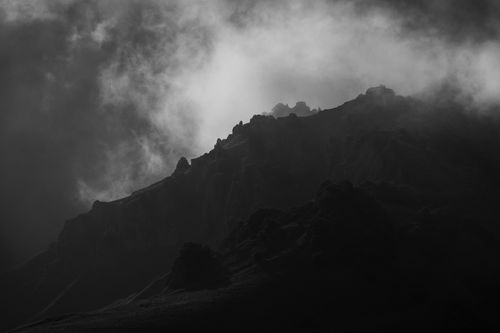 Free Black and white dramatic mountain silhouette with clouds in Chechnya, Russia. Stock Photo
