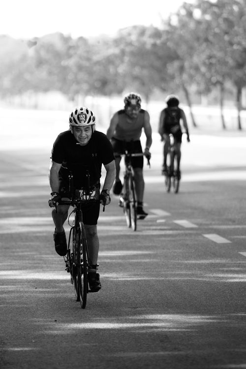 Free Black and white photo of cyclists racing on a sunny day in San Francisco de Campeche. Stock Photo