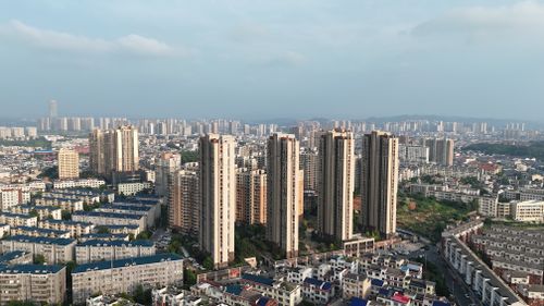 Free Aerial view of Changsha city with tall residential buildings under clear blue skies. Stock Photo