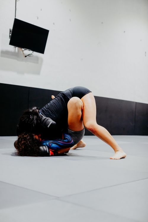 Free Two women engaged in a grappling match at a martial arts studio in Buenos Aires. Stock Photo