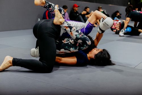 Free Two women engaged in grappling techniques during a martial arts class in Buenos Aires. Stock Photo