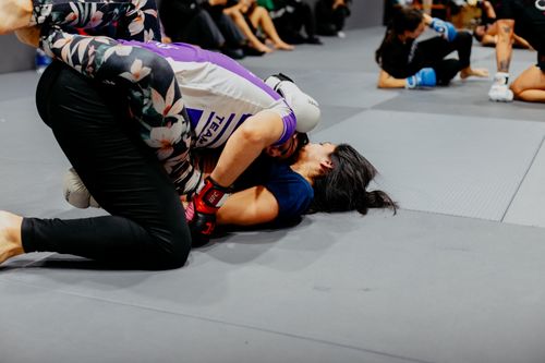 Free Women engaged in competitive martial arts training drill indoors. Stock Photo