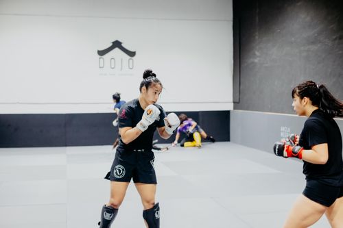 Free Two female martial artists sparring in a Buenos Aires dojo with focused intensity. Stock Photo