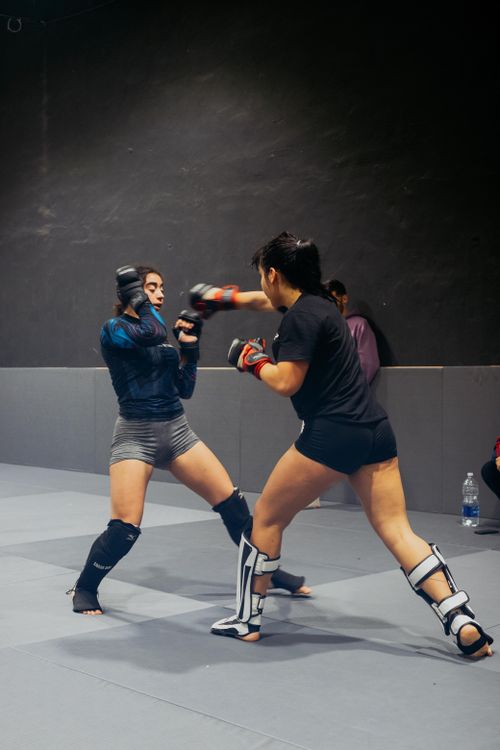 Free Two women engaged in martial arts training in a Buenos Aires academy, showcasing fitness and discipline. Stock Photo