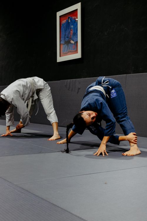 Free Two martial artists practice stretching exercises in a Buenos Aires dojo. Stock Photo