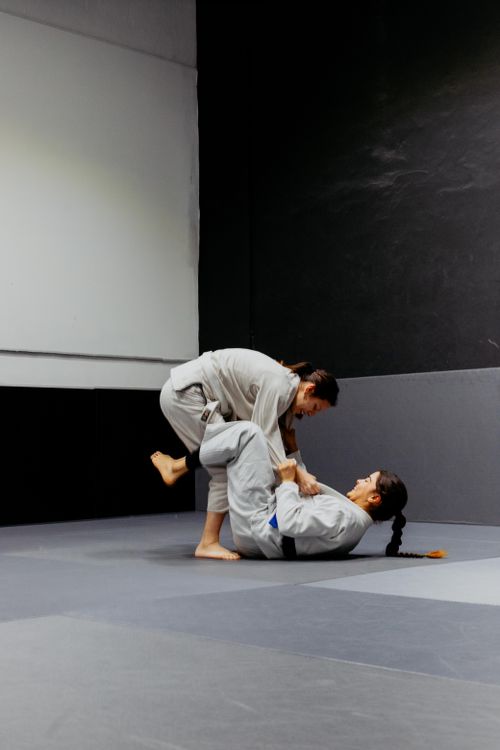 Free Two female martial artists practicing Brazilian Jiu-Jitsu indoors in Buenos Aires, Argentina. Stock Photo