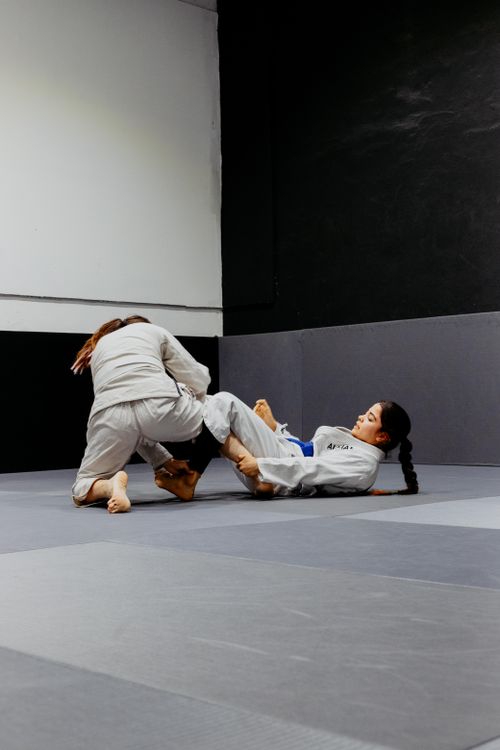 Free Two women practicing jiu-jitsu in a gym dojo in Buenos Aires, showcasing martial arts. Stock Photo