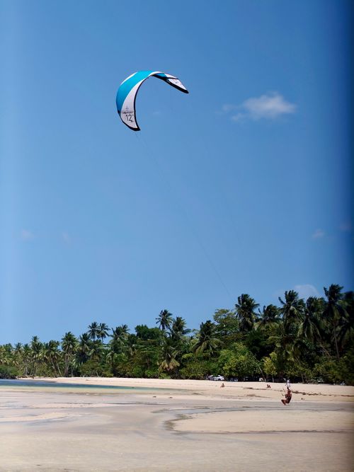 Free Experience the thrill of kiteboarding on the scenic beaches of Samaná, Dominican Republic. Stock Photo